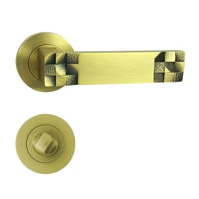 Produktbild von DOMINO Türgriff Drückergarnitur WC - Badezimmer Set | Rund-Rosette | Türbeschlag für Badezimmertüren | aus Znal | Bronze Matt Farbe | TORO-R M3 MATT |