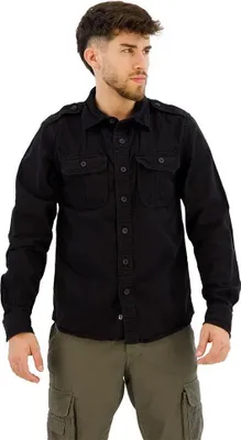 A man wearing a black shirt and green pants, posing for a product image.
