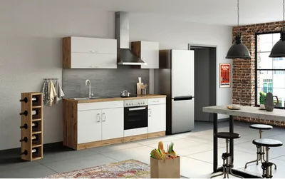 A modern kitchen with white cabinets, a wooden countertop, and stainless steel appliances.