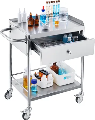 A stainless steel medical cart with multiple shelves and a drawer, filled with various laboratory supplies.