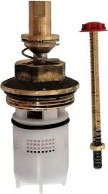 A close-up studio shot of a faucet cartridge and a threaded rod with a red cap.