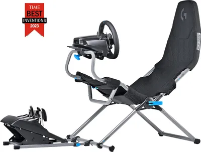 A racing simulator chair with a steering wheel and pedals, set against a white background.