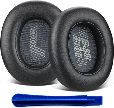 Two black ear pads for headphones and a blue plastic tool.