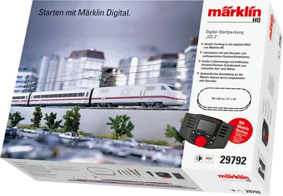A box for a Märklin HO scale model train set, featuring an ICE 2 train on a miniature track layout with buildings and cars in the background.