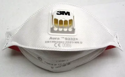 A white 3M Aura respirator mask with a yellow exhalation valve.