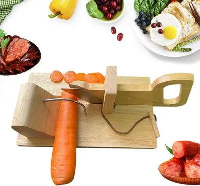 A wooden sausage slicer with a carrot being sliced, surrounded by various food items.