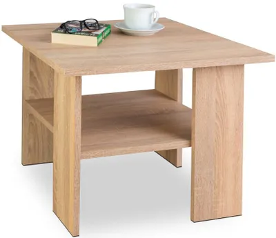 A light brown wooden coffee table with a shelf underneath, shown on a white background. A book, glasses, and a cup of coffee are placed on top.