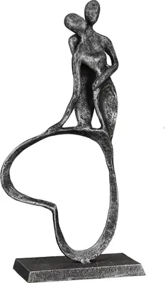 A decorative sculpture of two figures embracing, made of metal with an antique silver finish, standing on a rectangular base.