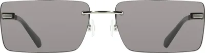 Zdjęcie produktu dla Eleganckie okulary przeciwsłoneczne dla kobiet z czarną metalową oprawką i przydymionymi szkłami