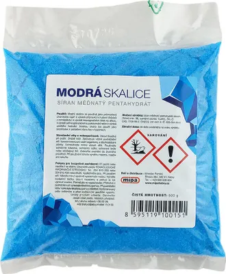 A bag of blue granular product with a label.