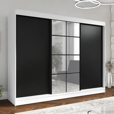 A modern wardrobe with sliding doors, some of which are mirrored.