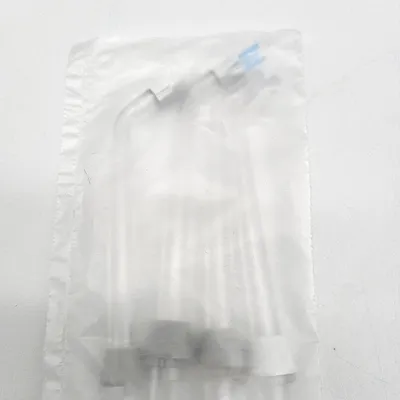 A clear plastic bag containing several Waterpik oral irrigator tips.
