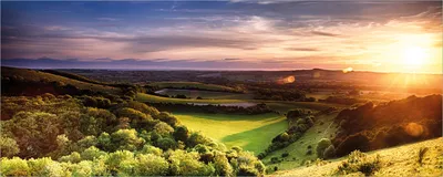 Produktbild von Wallario selbstklebendes Poster - Farbenfroher Sonnenuntergang in England, Größe: 80 x 200 cm