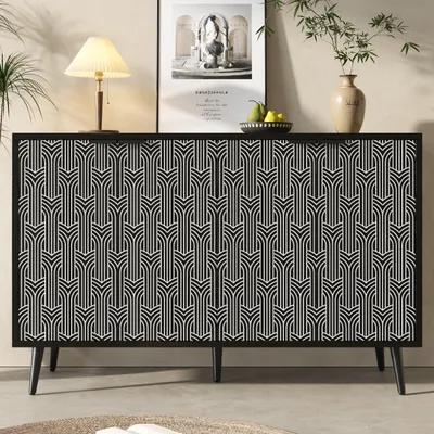 A black sideboard with a geometric pattern is shown in a room setting, with a lamp, a framed picture, and a vase on top.