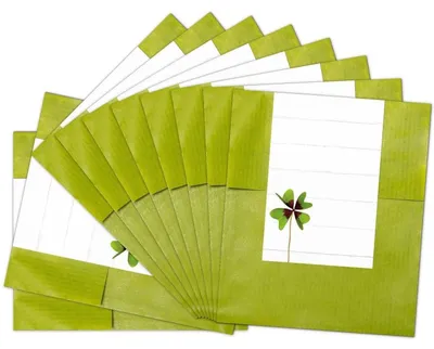 Produktbild von Logbuch-Verlag 25 kleine Papiertüten grün mit Aufkleber zum Beschriften weiß mit Kleeblatt - Mini Geschenktüten aus Papier