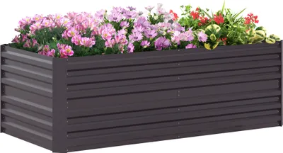 A raised garden bed filled with colorful flowers.