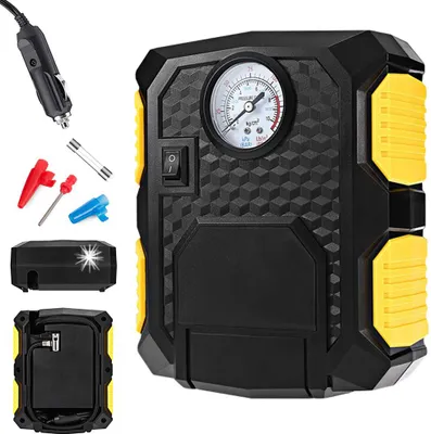 A black and yellow auto air compressor with accessories displayed around it.