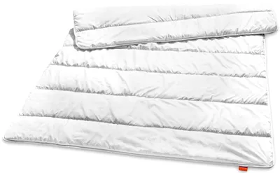 A white duvet is laid out on a white background.