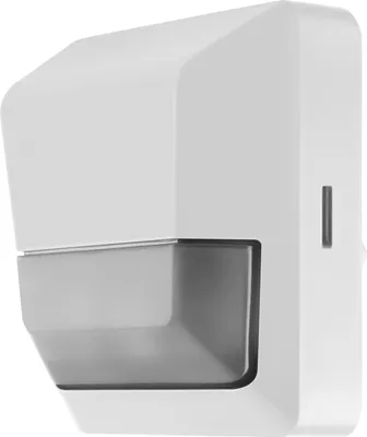A white motion and light sensor mounted on a wall.