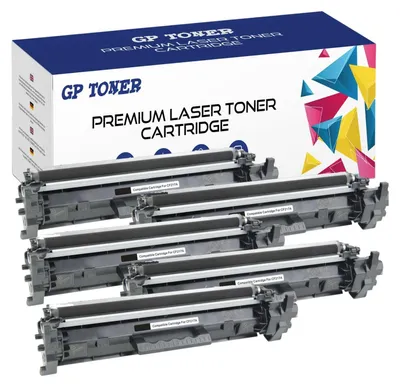 A box of toner cartridges with several cartridges stacked in front of it.