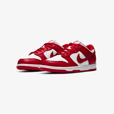 A pair of Nike Dunk Low Retro SP St. John's sneakers are displayed against a white background.