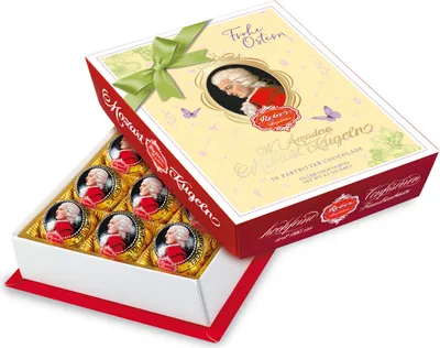 Produktbild von Reber Mozart Kugeln Barock 12er Packung mit Osteraufleger 240g