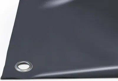 A close-up view of a dark grey PVC tarpaulin with a metal grommet.