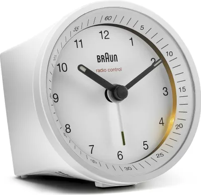 A white Braun radio-controlled alarm clock is shown against a white background.