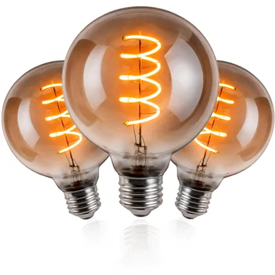 Three vintage-style LED light bulbs with spiral filaments, arranged in a cluster on a white background.
