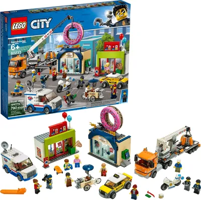 A LEGO City set box showing a street scene with a donut shop, vehicles, and minifigures.