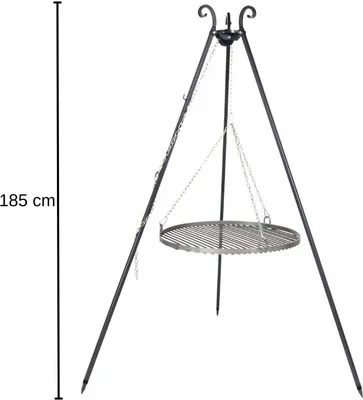 A black metal tripod grill stand with a round grill grate suspended by chains.