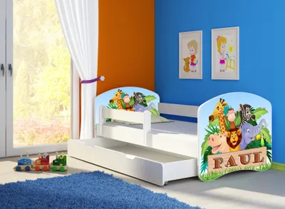 A child's bedroom with a white bed featuring cartoon animals and the name 'PAUL'.