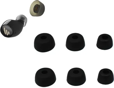A black wireless earbud with several black and one transparent ear tip replacements are arranged on a white background.