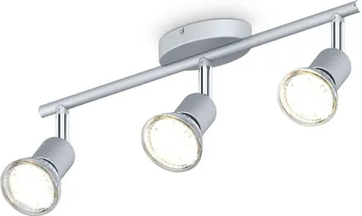 A three-light ceiling spotlight fixture with adjustable heads, mounted on a silver bar attached to a white ceiling.