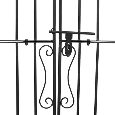 A close-up view of a black metal garden gate with a latch mechanism.
