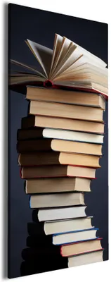 Produktbild von Wallario Premium Leinwandbild Bücherstapel in Größe 50 x 125 cm