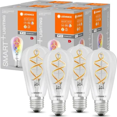 Product packaging for LED smart lighting bulbs, with several boxes stacked and some bulbs visible in the foreground.