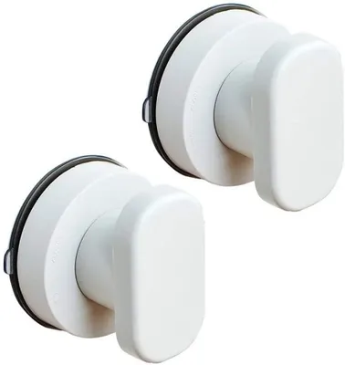 Two white suction cup hooks against a white background.