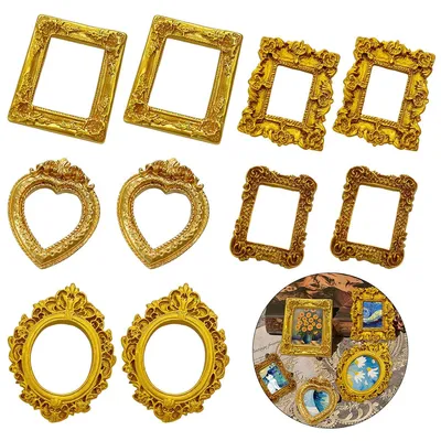 A collection of ornate, vintage-style picture frames arranged on a white background.