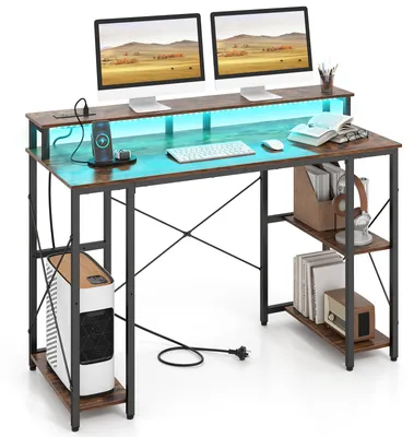 Immagine prodotto di Scrivania per computer COSTWAY con illuminazione LED, prese di corrente, supporto per monitor, scrivania angolare con ripiani e stazione di ricarica, colore marrone, dimensioni 120x50x87 cm