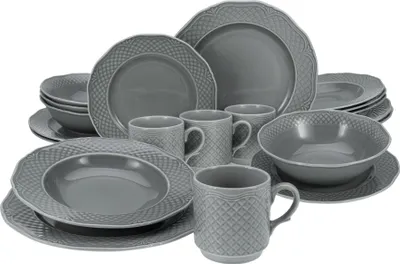 A collection of grey ceramic dinnerware, including plates, bowls, and mugs, arranged on a white background.