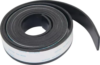 A rolled-up black rubber strip with white adhesive tape on one side.