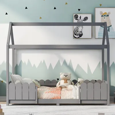 A child's bedroom with a house-shaped bed.