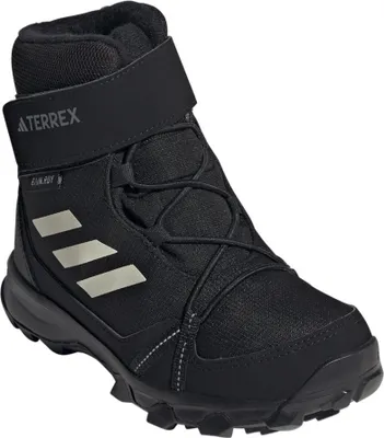 A single black Adidas Terrex winter boot for children.