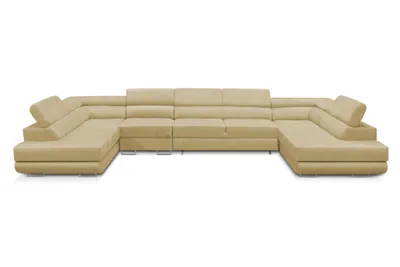 A large, U-shaped sectional sofa in a light beige color is shown against a white background.