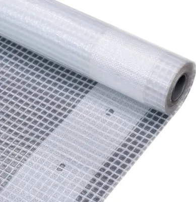 A roll of white tarp with a grid pattern is shown, partially unrolled.