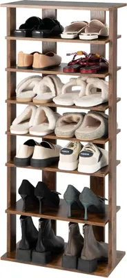 A multi-tiered wooden shoe rack filled with various types of footwear.