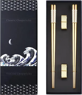 Image de Deux paires de baguettes en métal doré, en acier inoxydable 18/8, avec support, pour sushi