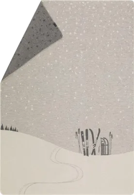 A winter scene with snow-covered hills, ski tracks, and skis leaning against a sled.