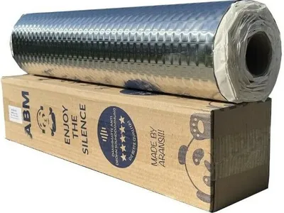 A roll of soundproofing material is placed on top of its cardboard packaging.